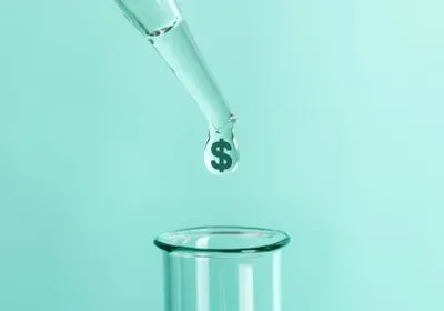 a pipette drops a dollar sign into a test tube